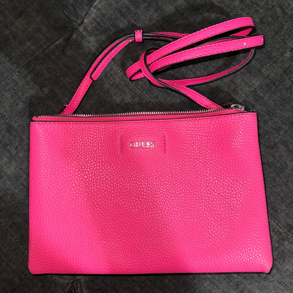Two zipper pouches with magnetic button between , medium sized Guess clutch.
